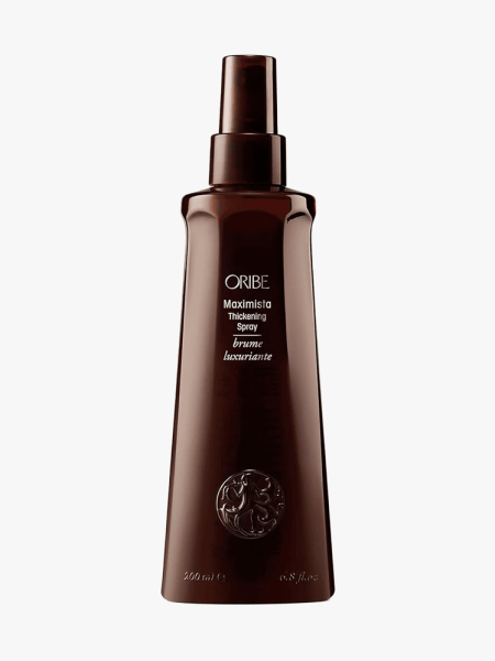 Oribe Maximista Thickening Spray in branded component on a light gray background
